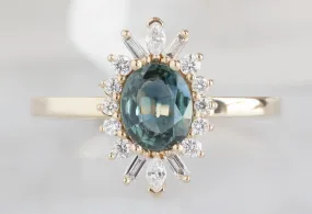 The Camellia Ring with a .72ct Oval-Cut Teal Sapphire