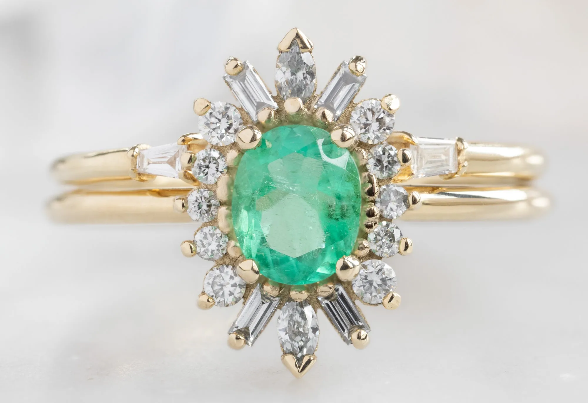 The Camellia Ring with an Oval-Cut Emerald